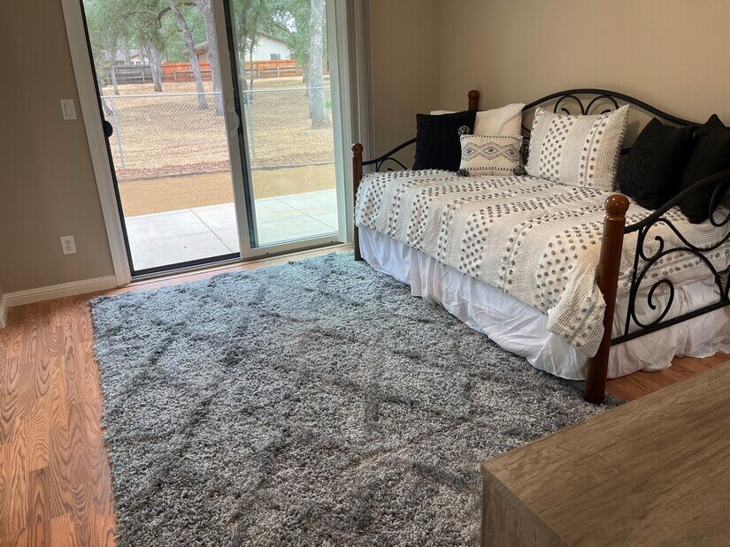 Inviting bedroom with view of back yard area