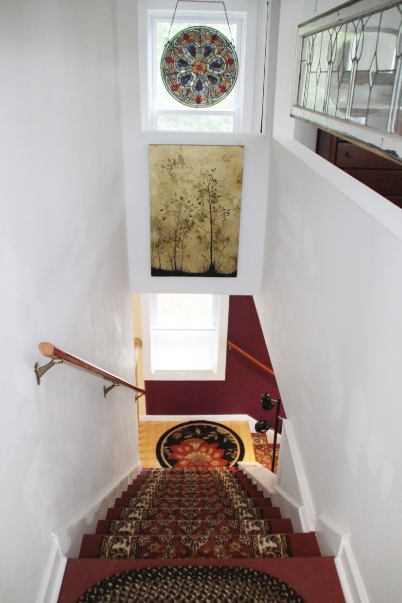 Second story with oriental carpeted stairs