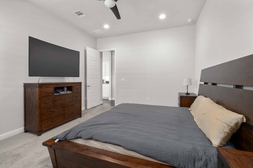 Master bedroom with king bed and smart TV