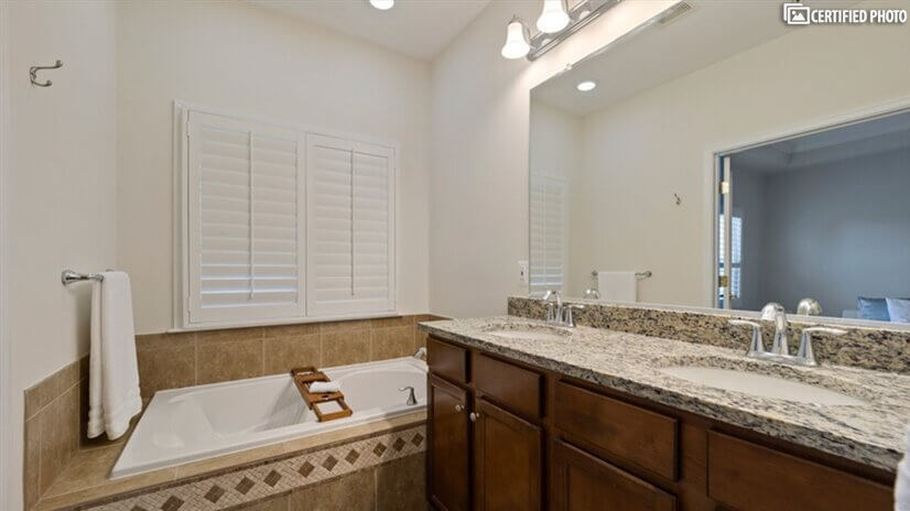 Master bath with dual sinks and soaking tub.