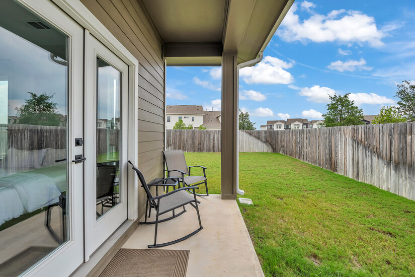 Patio with fenced backyard