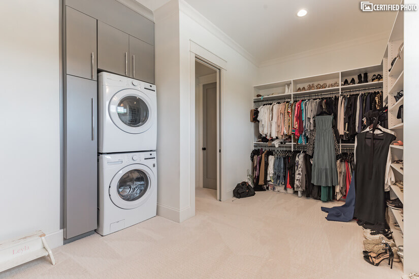 Huge walk in closet equipped with master's washer/dryer