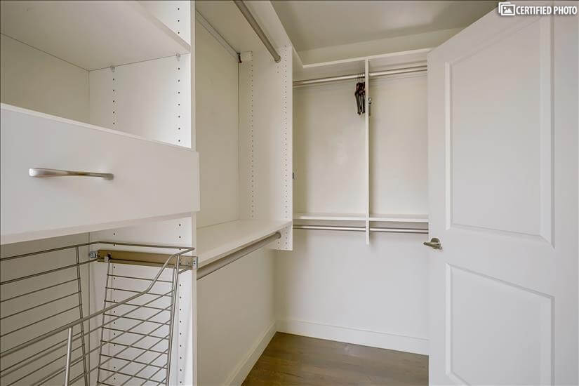 Bedroom 1 Closet Shelving w/ Laundry & Dry Cleaning Bins