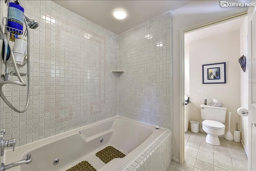 Extra large tub & shower  connects to second upstairs bath.