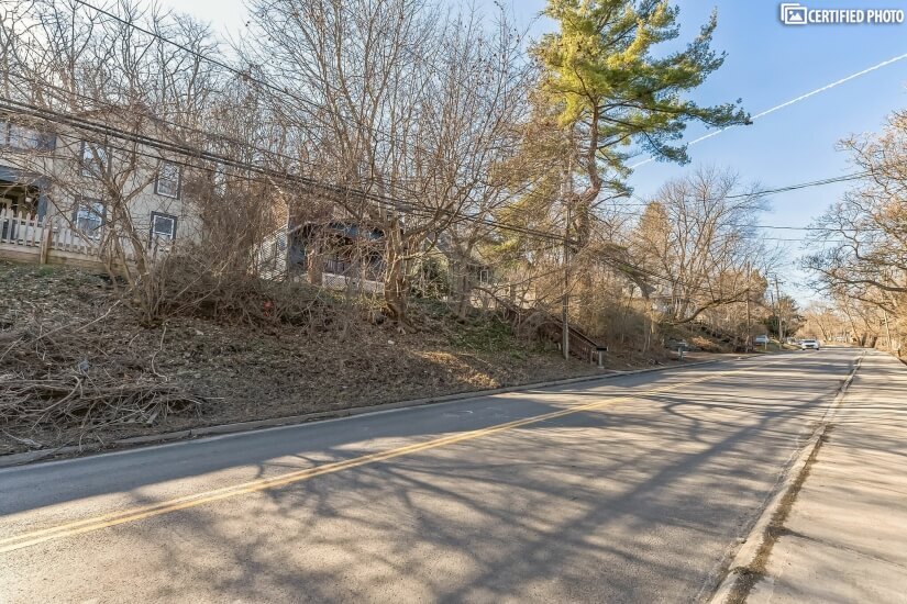 Large mature trees on lot provide ample shade to front yard