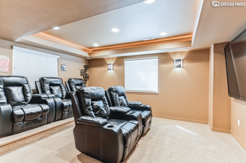 THEATER ROOM with HUGE tv & 5 recliners