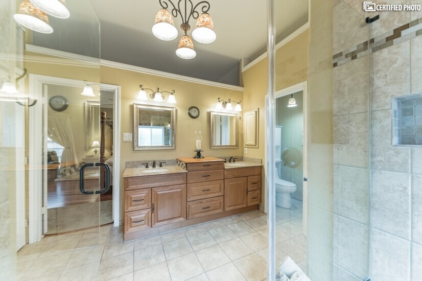 Master bath features 2 walk in closets and dual shower heads