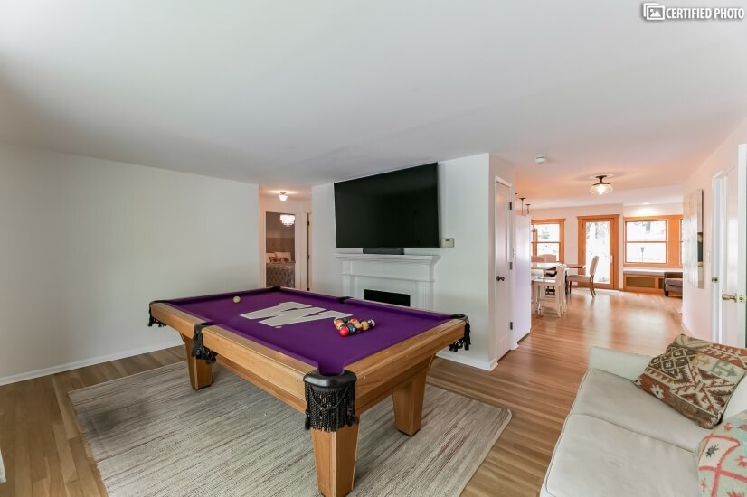 Living Room Pool Table With View To Kitchen/Dining Area