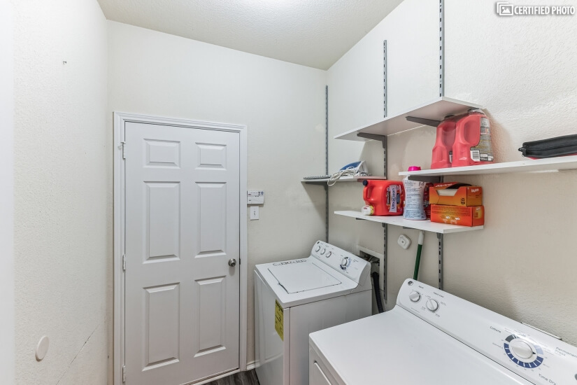 Laundry room with full washer and dryer