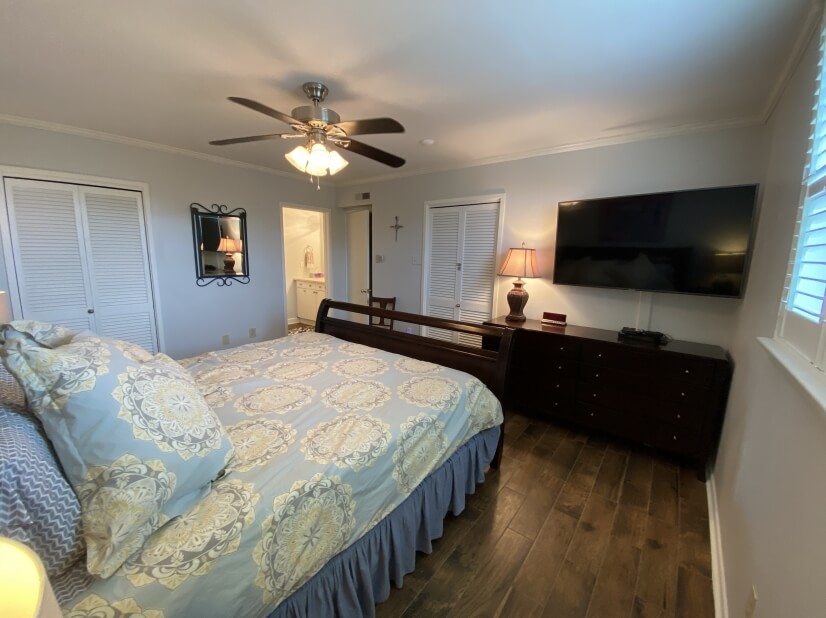 Master bedroom with 50” TV and DVD player
