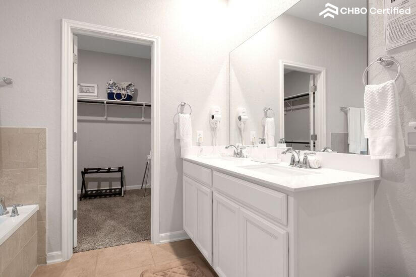 Spacious walk-in closet next to master bathroom.
