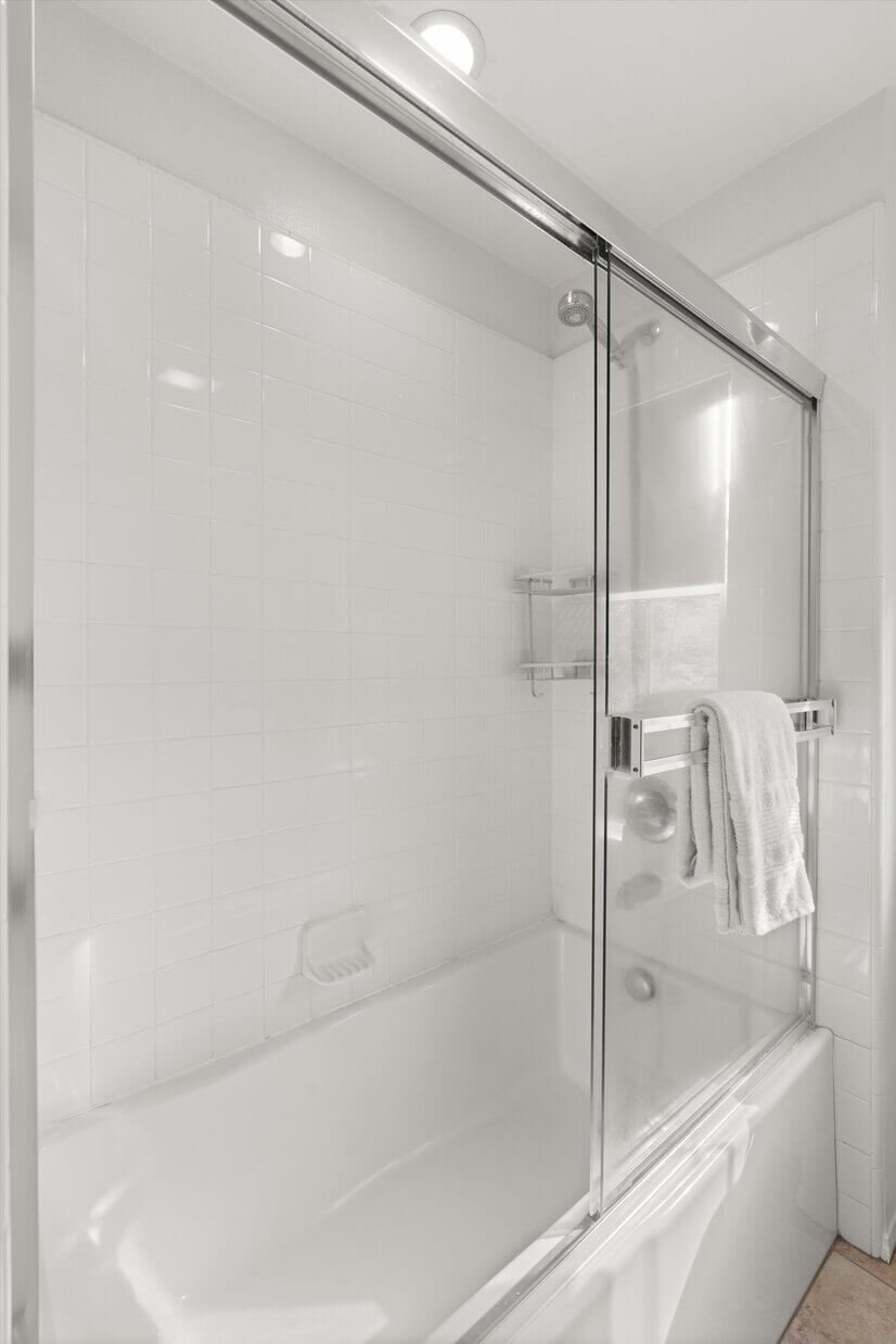 Primary bathroom shower and bathtub