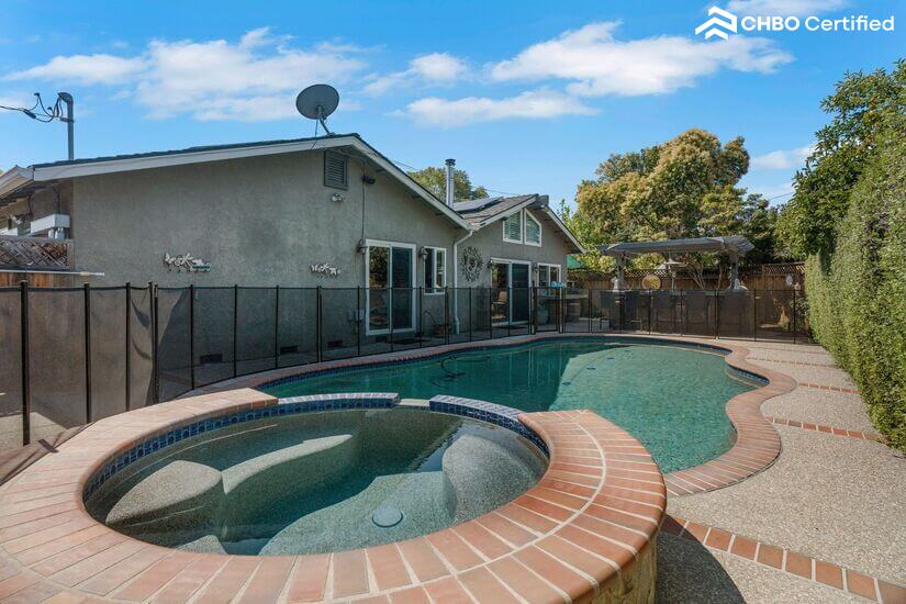 Swimming pool & hot tub with safety pool fence