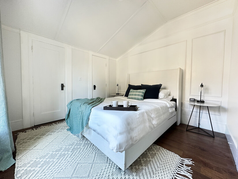 Relax and recharge in this elegant master bedroom