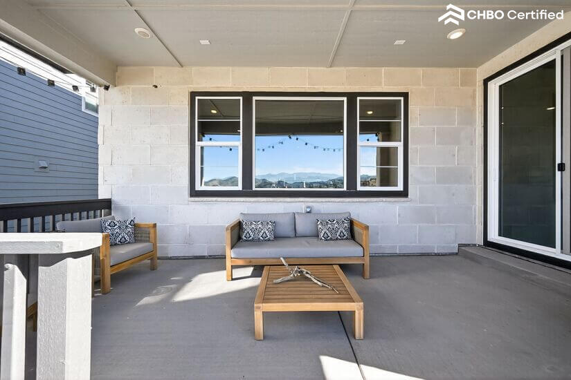 Lighted, furnished, and decorated back porch
