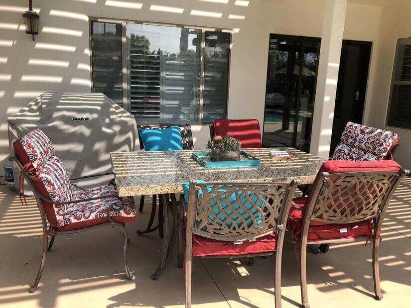 BBQ, outdoor fridge, and dining table
