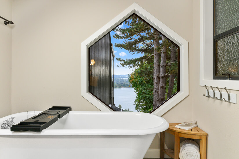 Relax in the tub with epic views of the river