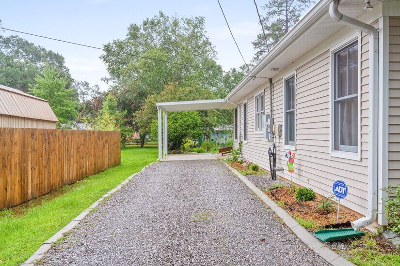 Long driveway with carport