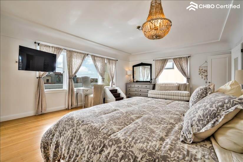 view of tv in king bedroom