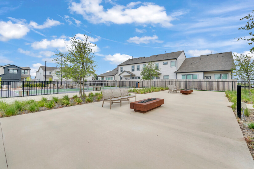 Outdoor lounge area with fire pits.