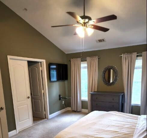 Master bedroom King bed with vaulted high ceiling