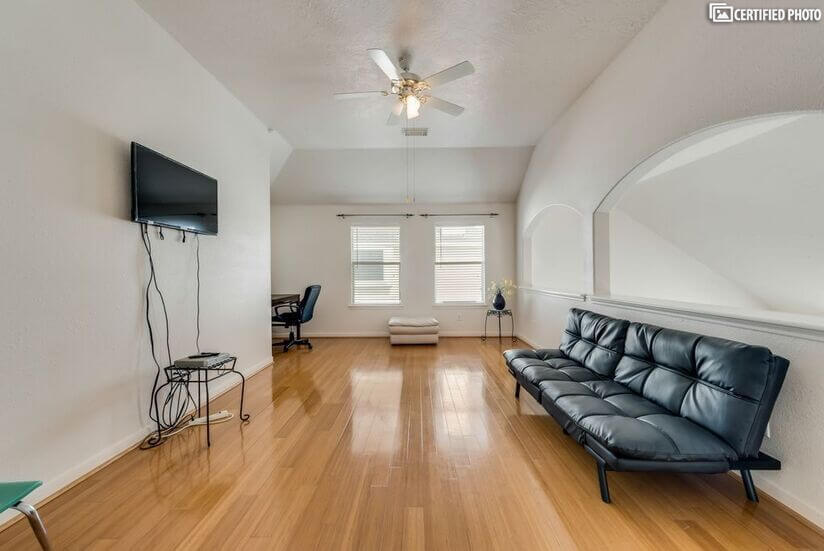 Open game room upstairs  with bamboo flooring  entire floor.