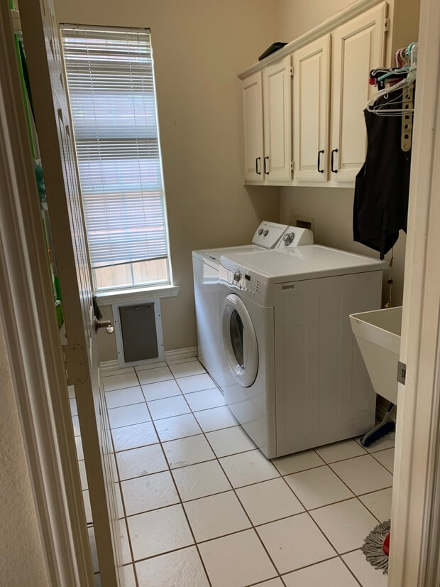 Laundry room with doggy door