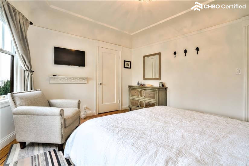 view of tv and chair in bedroom 1