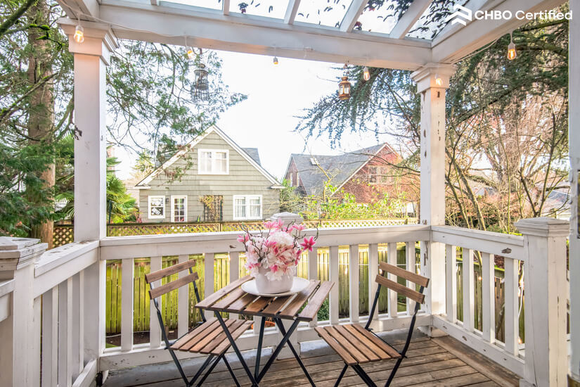 Porch off main bedroom leading into the fenced backyard