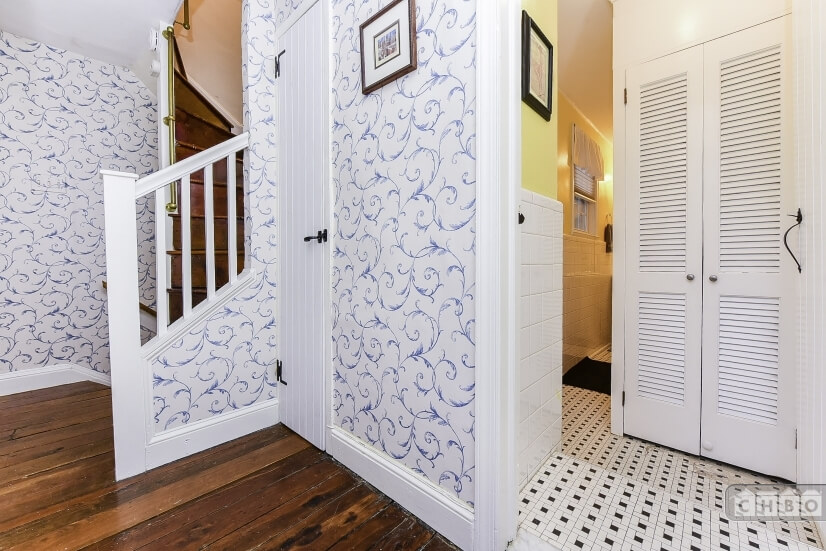 Stairs to third floor and entrance to bathroo