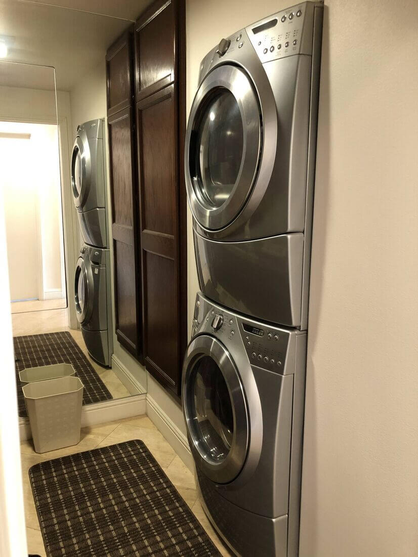 Washer/dryer and built-in ironing board