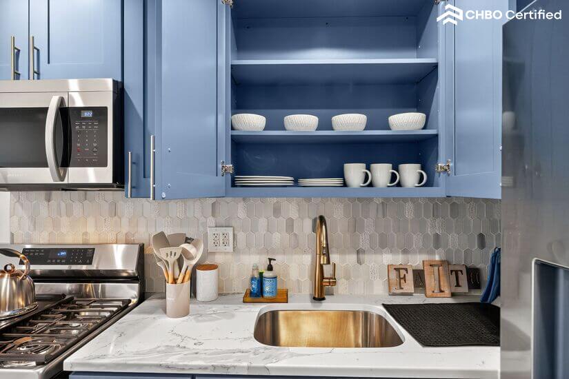 Kitchen with cooking utensils, plates, cups and bowls