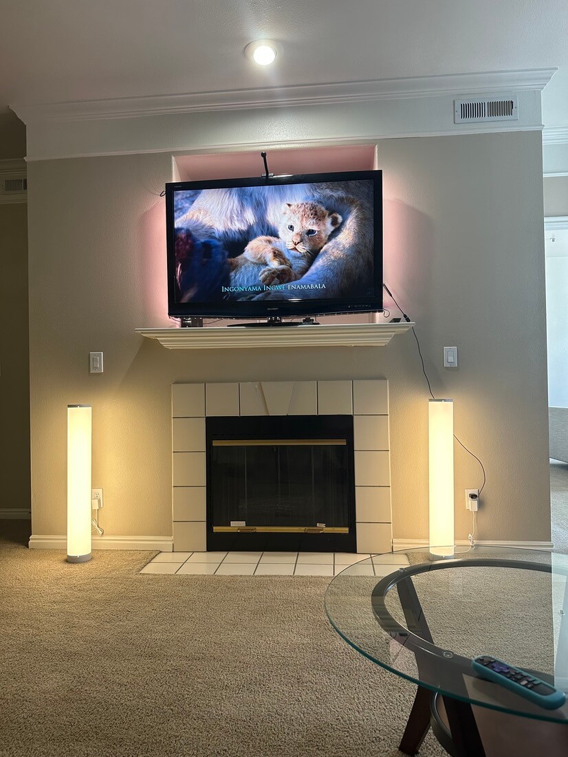 Spacious living room with 55 inch tv and LED lights