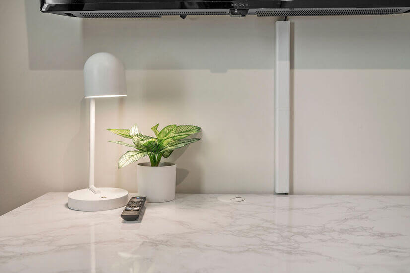 Guest BR3 with desk lamp and plant