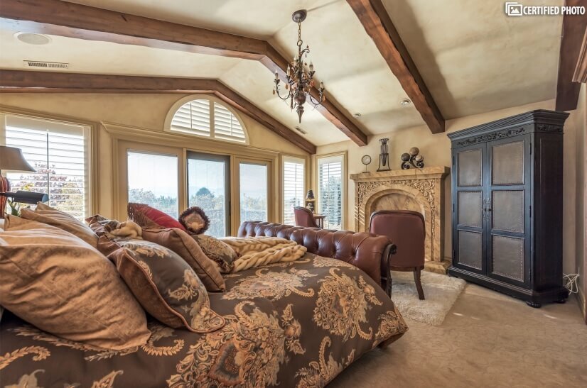 Master bedroom with custom King sleigh bed/fireplace & views