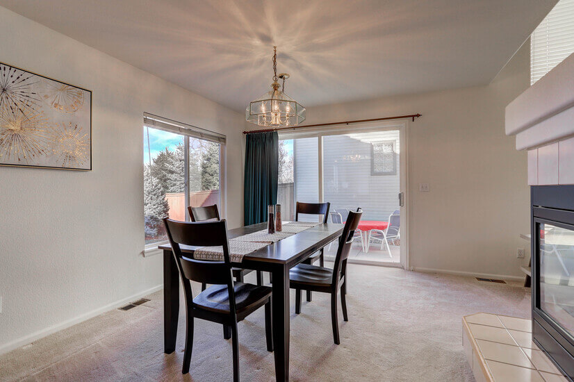 Dining room, 3-sided fireplace, and access to the backyard