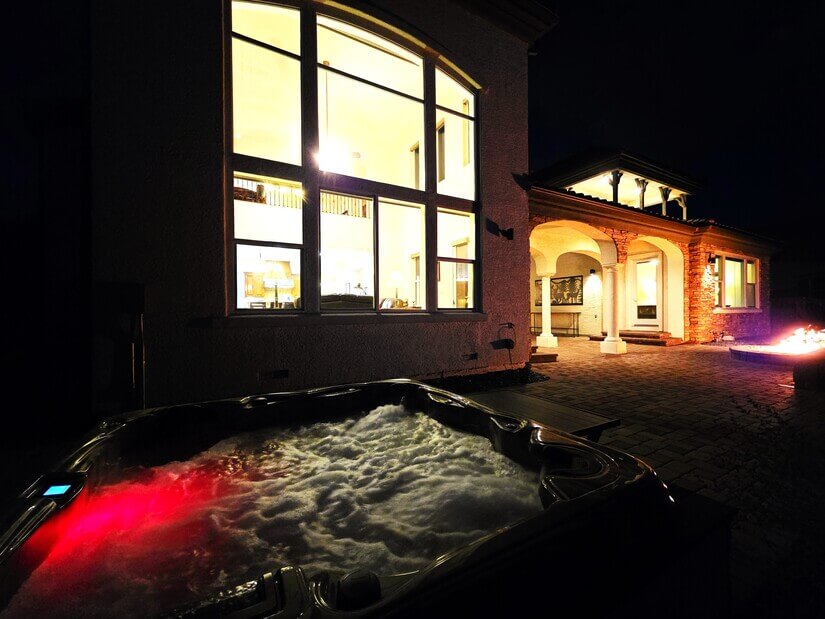 rear elevation hot tub firepit night