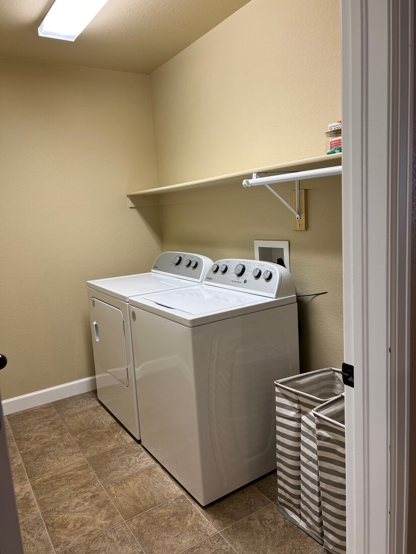 Laundry room full sized ironing board/iron/clothes steamer