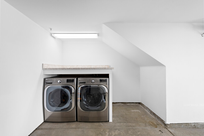 Washer and dryer on first level in the garage.