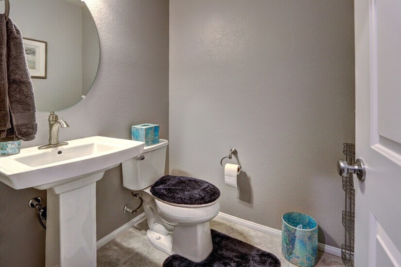 Cute powder room off of the entrance