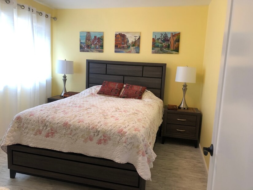 bedroom with a desk and garden view