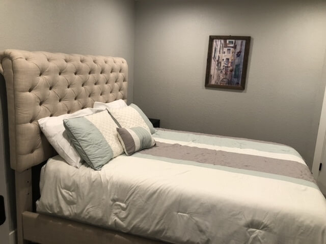 Basement bedroom with Queen bed.
