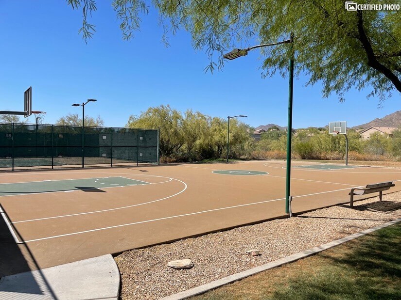 HOA basketball court with lights for evening games