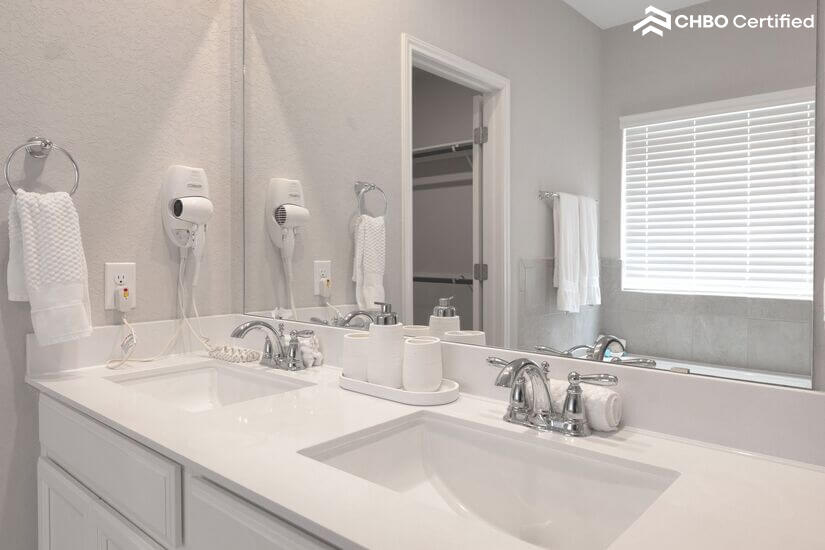 Wall-mounted hair dryers in 3 full bathrooms.