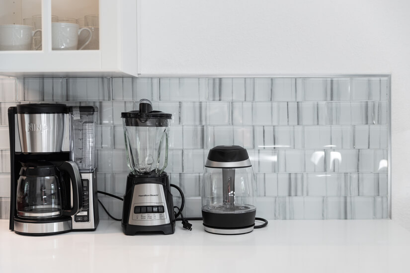 New coffee maker, water kettle, blender, and more in kitchen