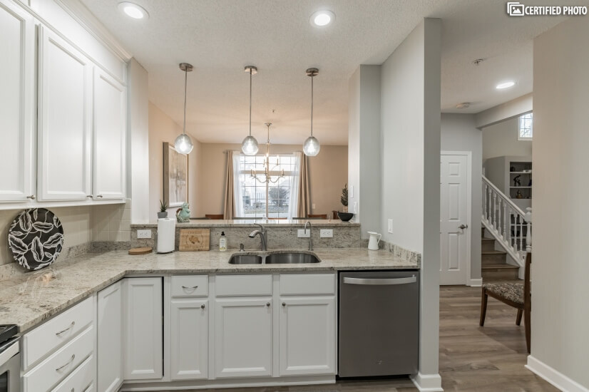 fully equipped kitchen with stainless steel appliances
