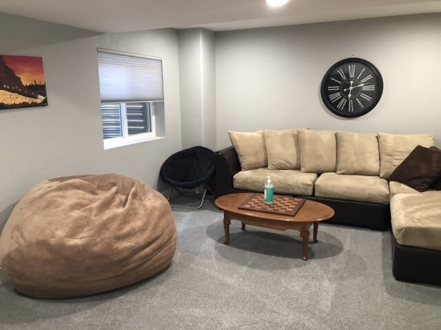 Large basement couch and oversized bean bag c