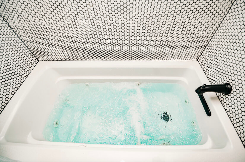 A whirlpool tub awaits inside the primary bat