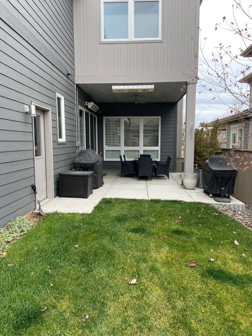 Small fenced backyard with patio