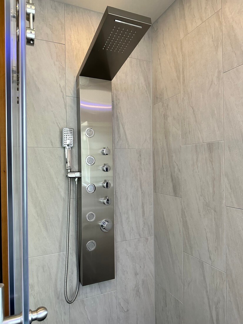 Shower panel features rainfall, waterfall, body jets & wand